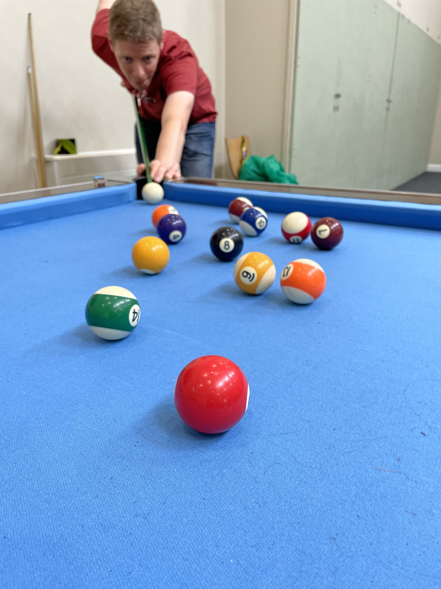 Young person playing snooker at the church